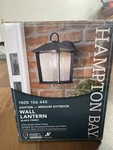 Hampton Bay Ashton 10.87 In. 1-LIGHT Black Hardwired Wall Lantern Sconce. Fixed Price $25.00.