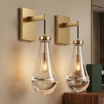 2 Pack Indoor Wall Light Raindrop Elegant Gold Sconce Clear Glass Fixture. Fixed Price $174.99.