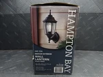 Hampton Bay 14 In. 1-LIGHT Black Dusk-to-dawn Outdoor Wall Lantern Sconce. Fixed Price $30.99.