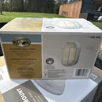 New Hampton Bay White Finish 8" Round Exterior Wall Light Frosted Ribbed Glass. Fixed Price $25.00.