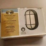 Hampton Bay Exterior Wall Light 240 235 Black Oval, Frosted Ribbed Glass. Fixed Price $16.00.