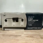 Hampton Bay Evangeline 23 In. 3-LIGHT Modern Bronze Bathroom Vanity. Fixed Price $9.99.