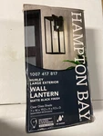 Hampton Bay 44772 Hurley Farmhouse Outdoor Wall Sconce, Matte Black With Clear G. Fixed Price $47.47.