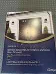 Cattleya Motion Sensor Dusk To Dawn Outdoor Wall Sconce. Fixed Price $49.99.