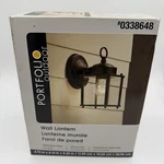 Portfolio Outdoor Wall Lantern Matte Black Finish And Clear Glass 4.7X6.1X8.25". Fixed Price $12.99.