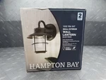 Hampton Bay 8.2IN 1-LIGHT Black Outdoor Wall Lantern Patio Sconce (2-PACK). Fixed Price $14.99.