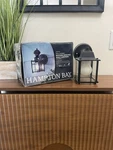Hampton Bay 9.5IN 1-LIGHT Farmhouse Motion Sensing Outdoor Wall Lantern. Fixed Price $20.00.