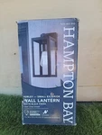 Hampton Bay Hurley 12 In. Matte Black Hardwired Outdoor Wall Lantern.. Fixed Price $39.99.