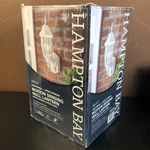 Hampton Bay Alexandria Motion-sensing Decorative Wall Lantern White Mount. Fixed Price $34.99.
