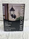 Hampton Bay 1-LIGHT Black Finish Medium Exterior Wall Lantern Open Box. Fixed Price $24.95.