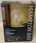 Hampton Bay 14 In. 1-LIGHT White Hardwired Dusk-to-dawn Outdoor Wall. Fixed Price $46.78.