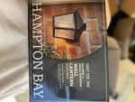 Hampton Bay 5294503012 Malena 1-LIGHT Black Outdoor Wall Lantern Sconce, Seeded. Fixed Price $22.13.