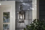 Home Decorators Walcott Manor 11.5 In 1-LIGHT Antique Bronze Outdoor Wall Sconce. Fixed Price $42.99.