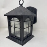 Hampton Bay Exterior Wall Lantern Light Aged Iron Black Seeded Glass. Fixed Price $35.95.
