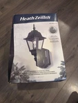 Heath Zenith HZ-4191-BK Black 180 Farmhouse Outdoor Wall Sconce With Glass. Fixed Price $55.99.