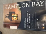 Hampton Bay- Led Flame Effect Wall Lantern And Matte Black Finish. Fixed Price $65.00.