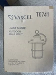 Vaxcel Lighting Lake Shore 10" Tall Outdoor Wall Sconce With Clear Glass Shade. Fixed Price $64.99.