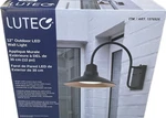 Lutec 12" Wall Light 1200 Lumens Dusk To Dawn Sensor Matte Black 3000K Color. Fixed Price $36.00.