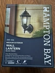 Hampton Bay 14.5 In Black Dusk Dawn Outdoor Exterior Wall Lantern Light. Fixed Price $53.93.